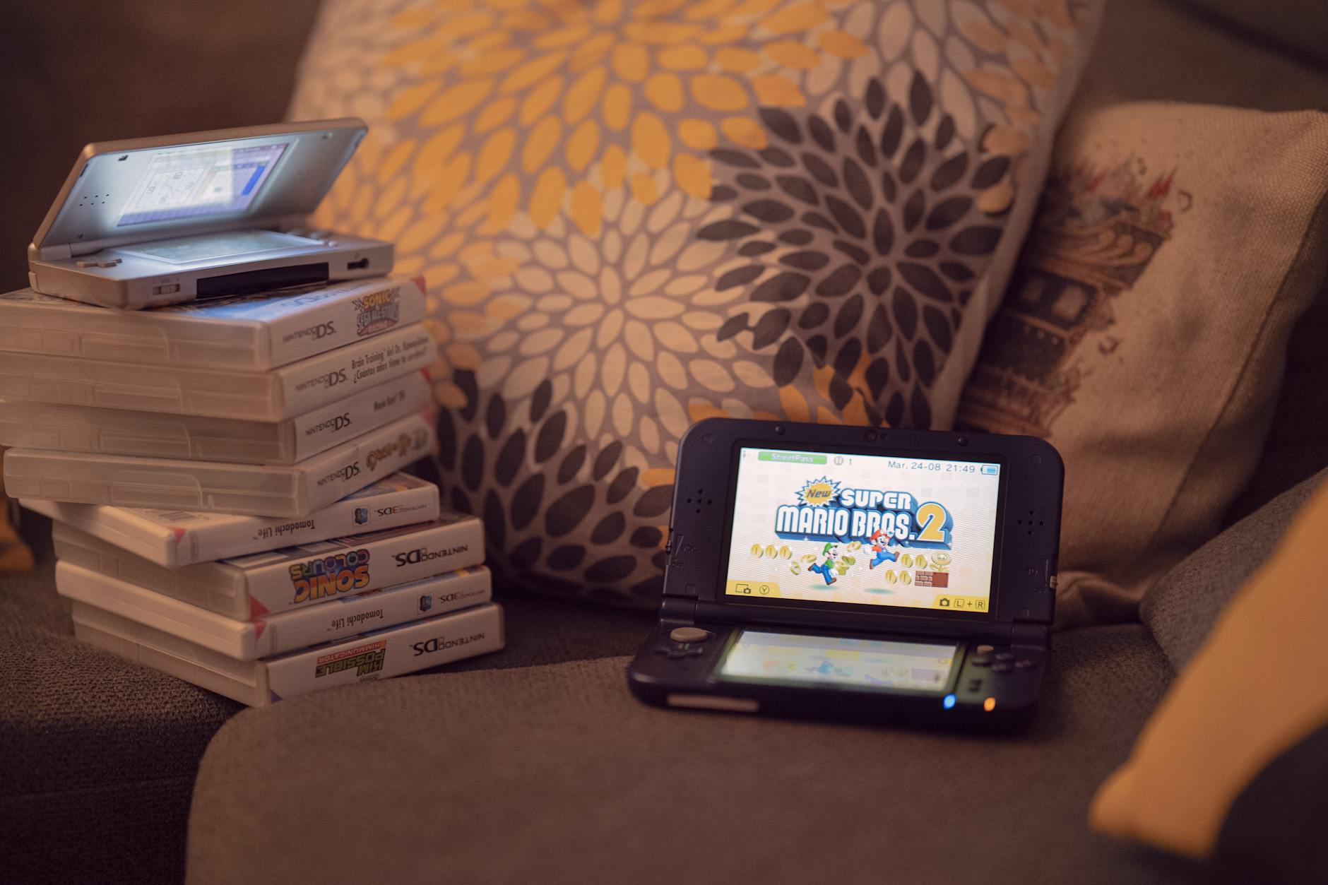 A collection of vintage video game cartridges laid out, referencing the Game Boy era of gaming