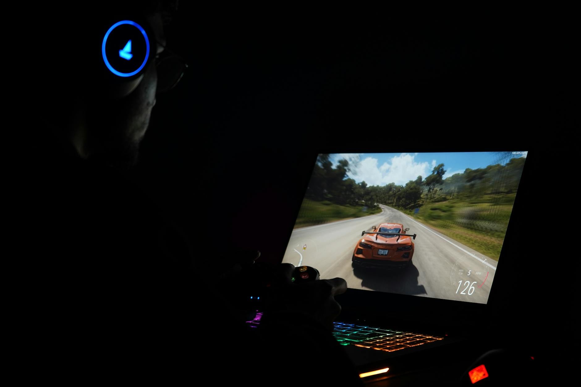 Close-up of a gaming laptop screen displaying colorful game graphics