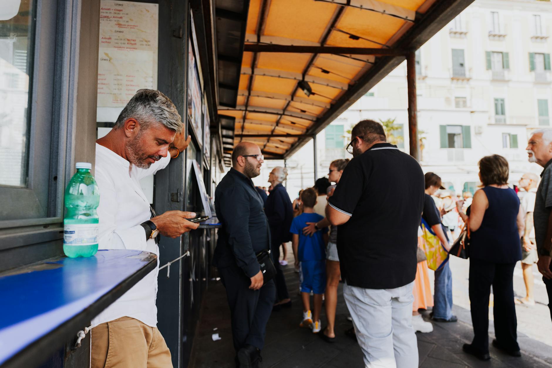 A crowd of people waiting in line, symbolizing anticipation and prolonged patience