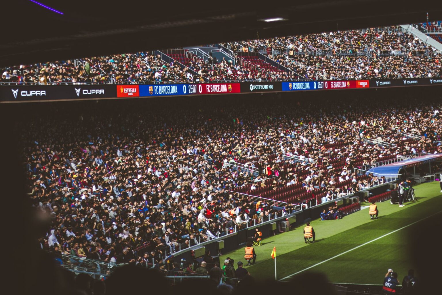 Fans watching an intense soccer match from the stands