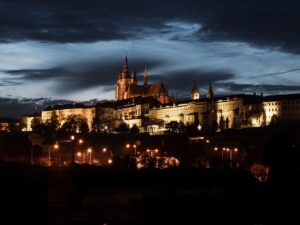 A dark gothic castle illuminated at night, evoking the visual atmosphere of the Castlevania franchise