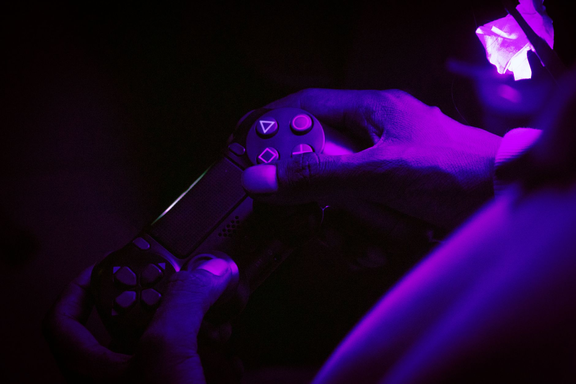 A gaming controller resting on a dark surface, symbolizing waiting and anticipation