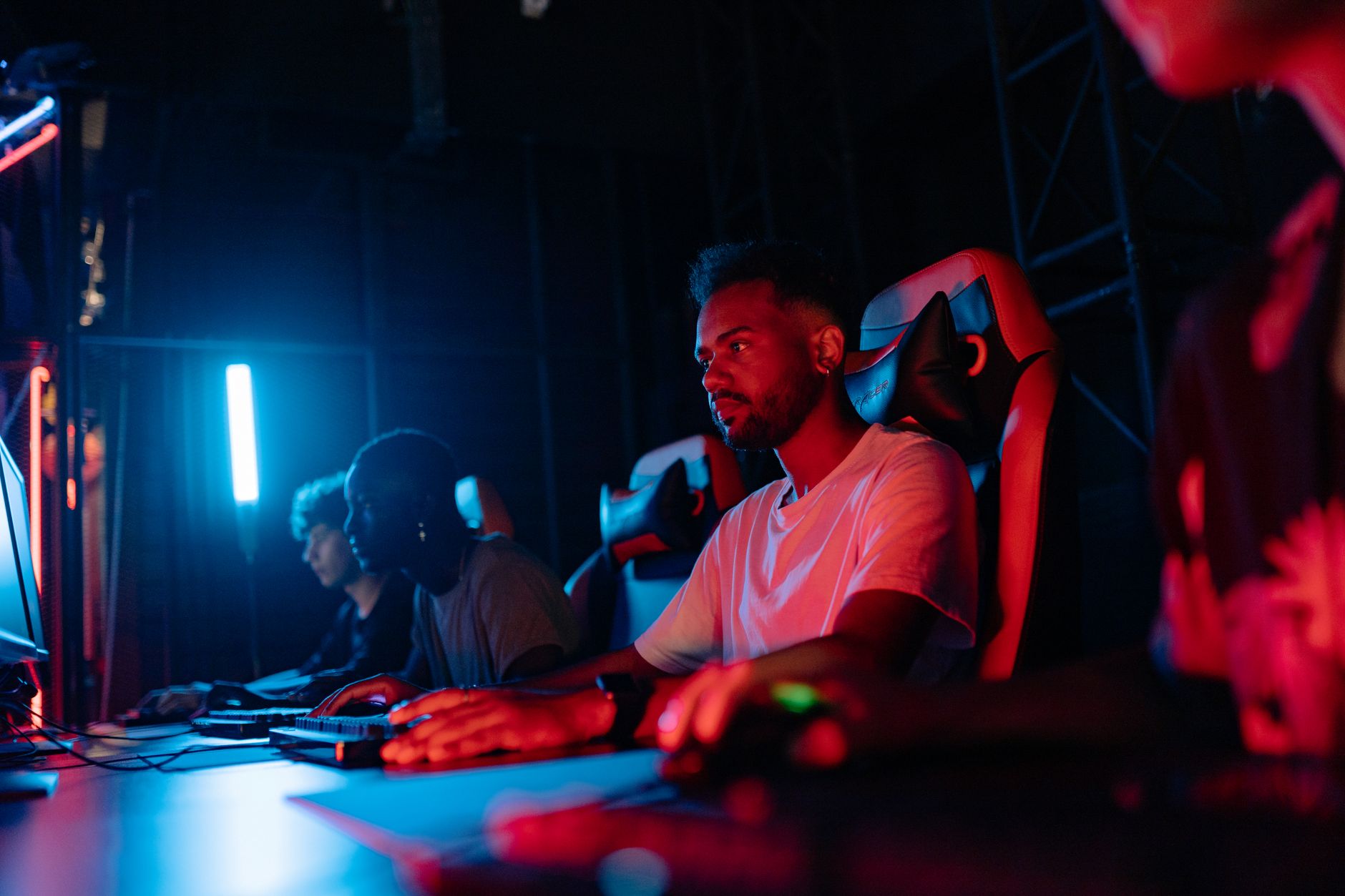 A player at a competitive gaming setup, highlighting the demands of ranked online play