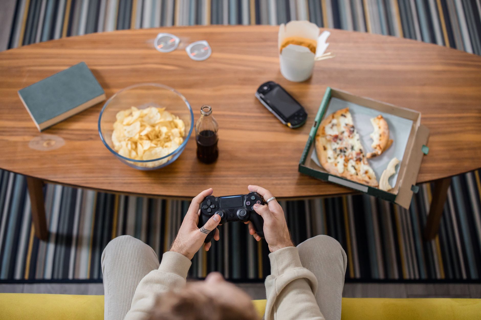 Person playing a video game console on a television screen