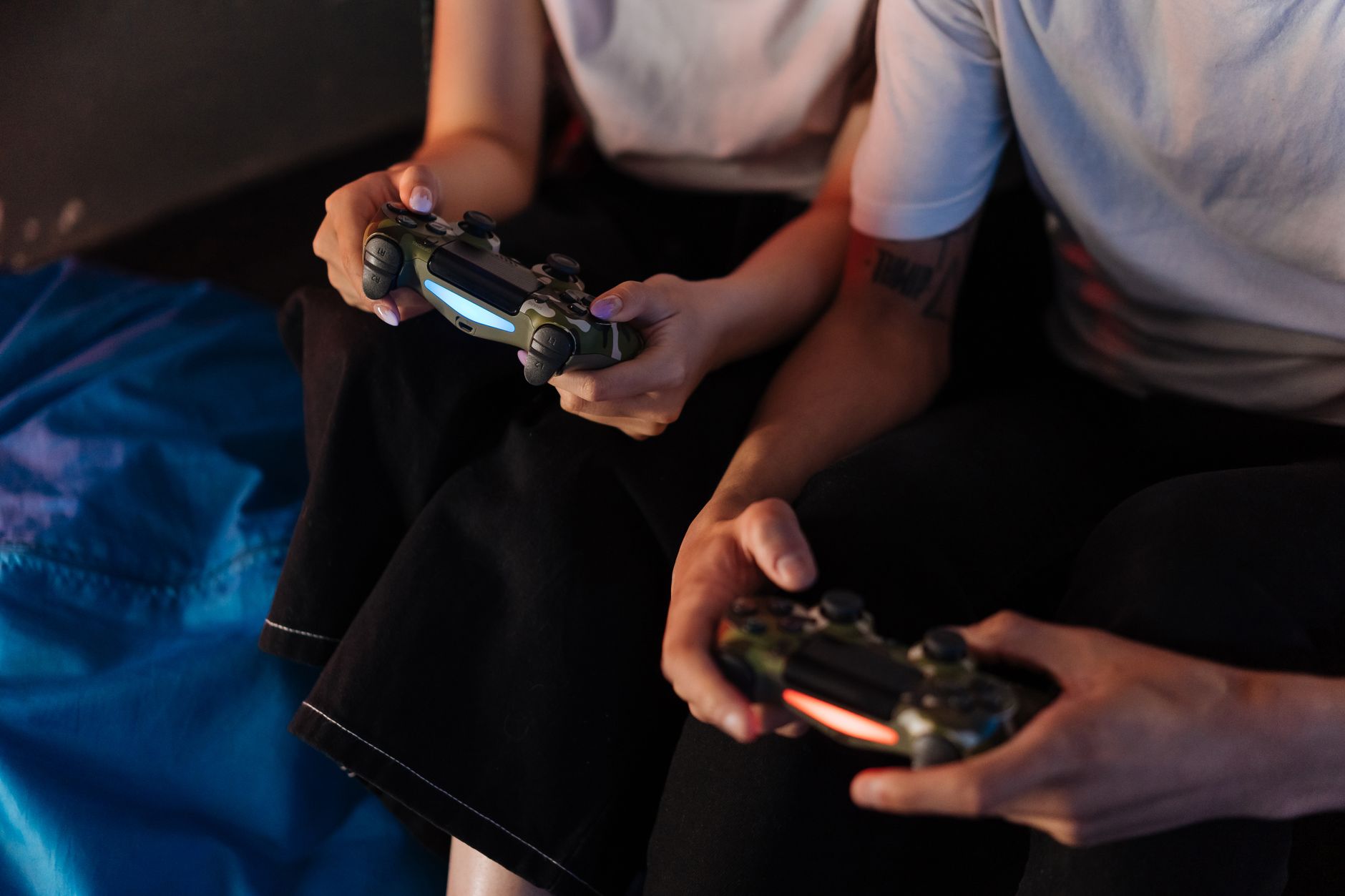 Colorful gaming controllers laid out on a flat surface