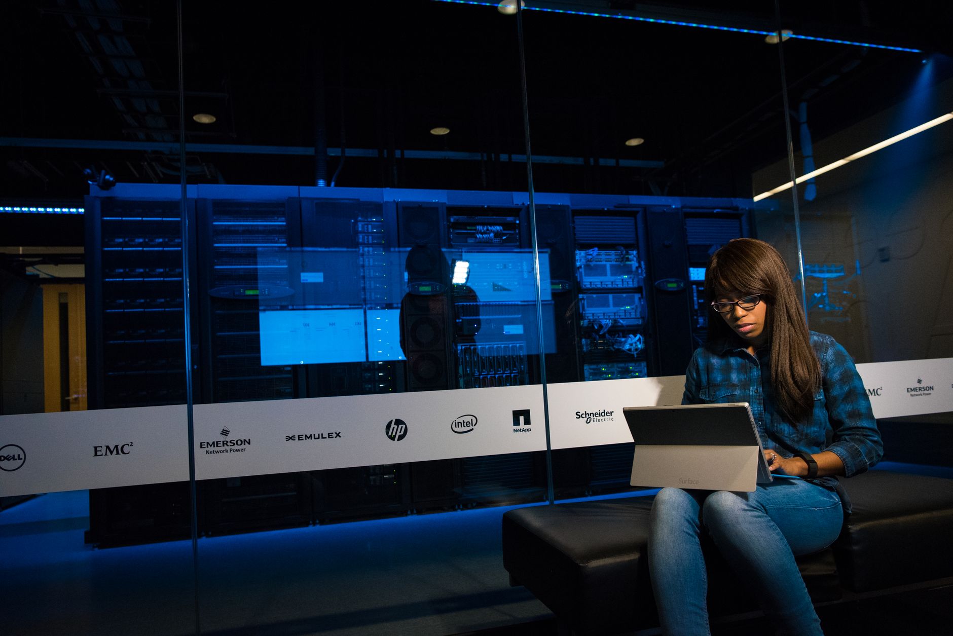 Dark server room with glowing lights representing a live service game infrastructure