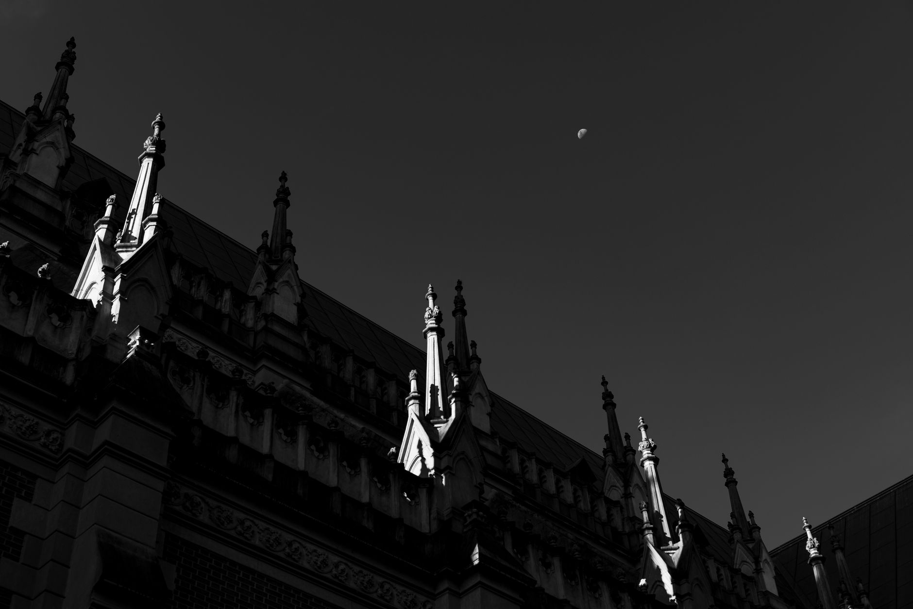 Dark gothic stone architecture with fog, evoking the visual style of Bloodborne's Yharnam setting