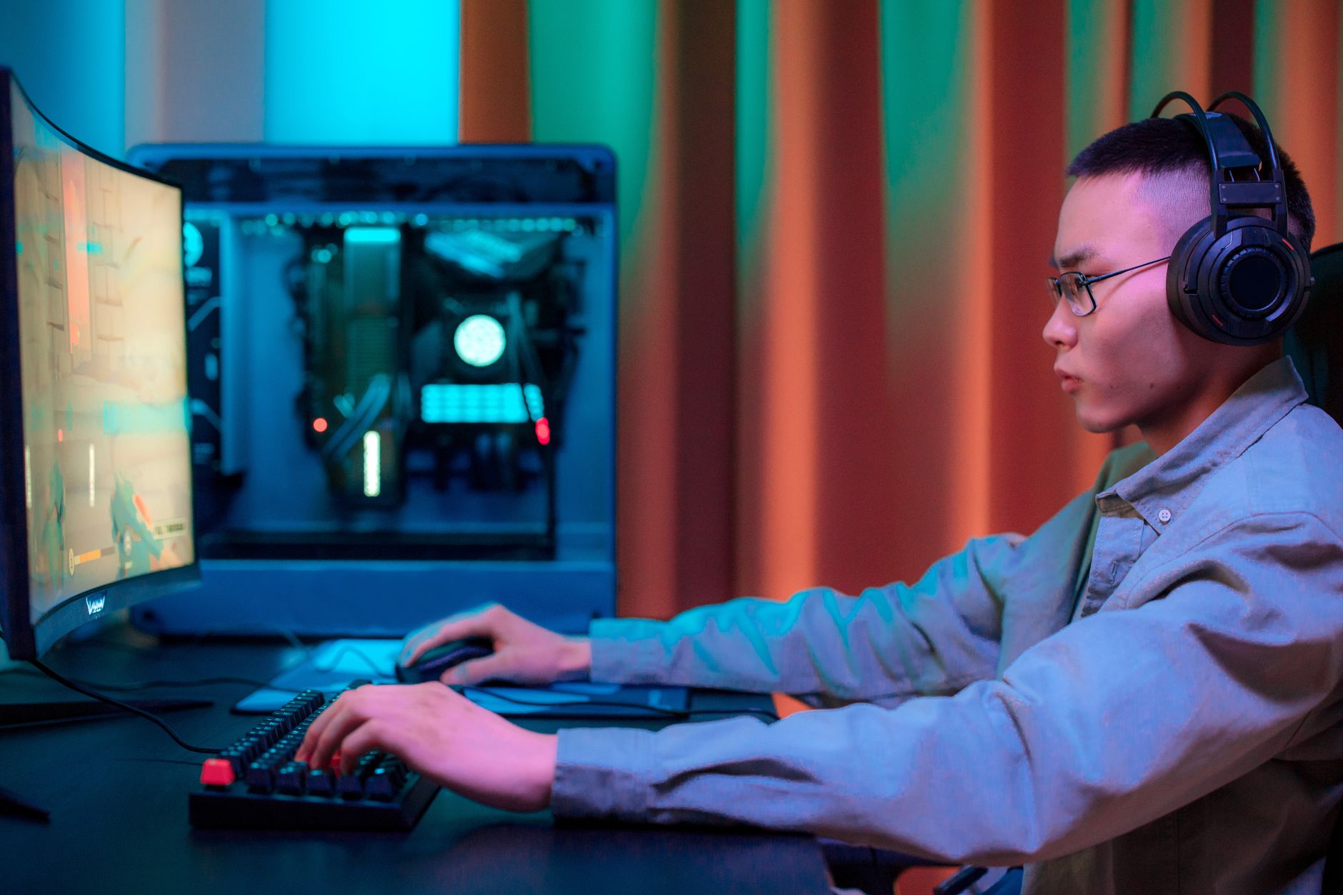 Person using a gaming controller at a desk setup