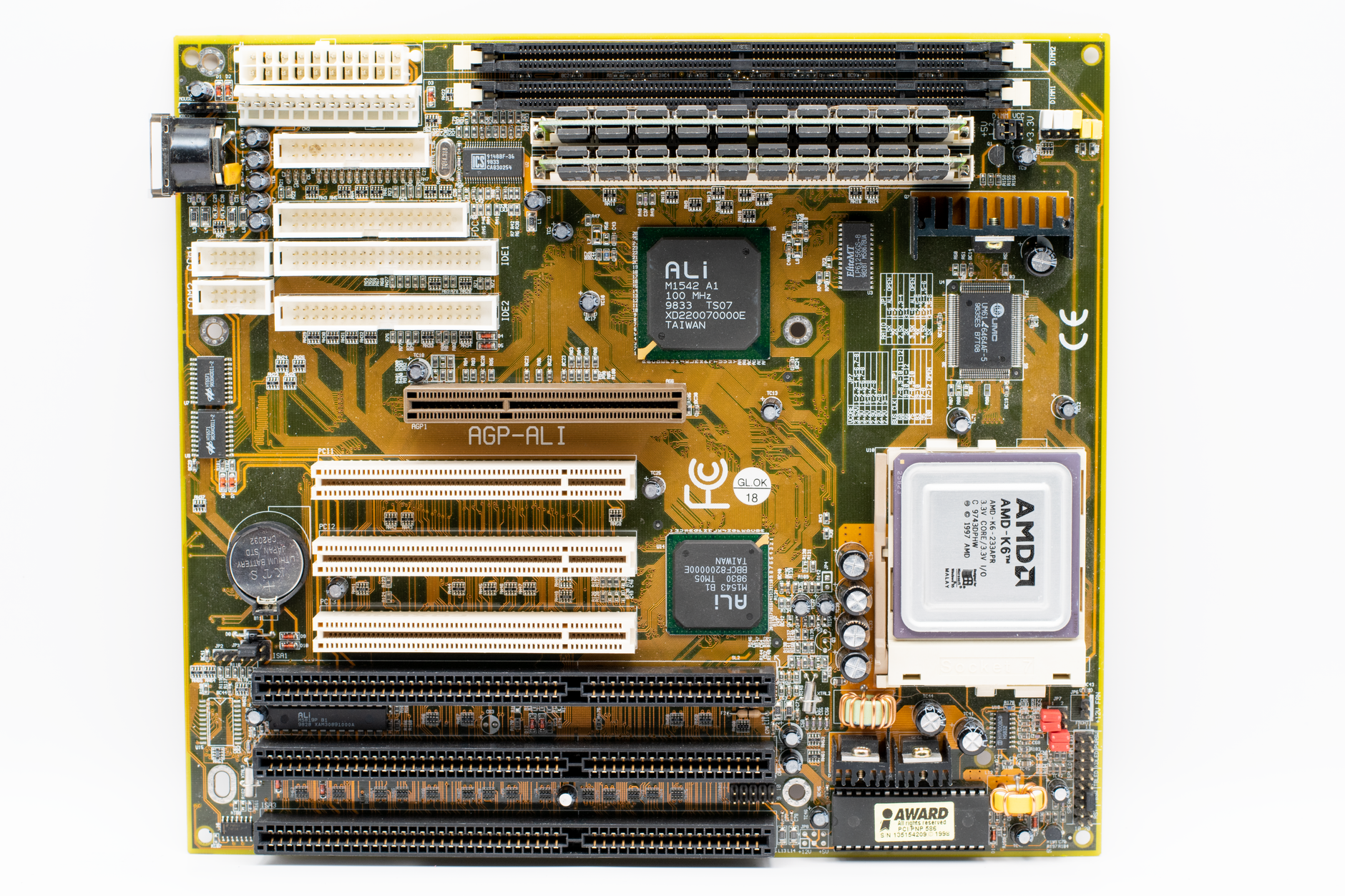 Various PC components laid out on a desk including a graphics card and motherboard