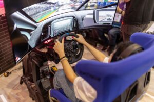A game controller resting on a surface, representing video game racing mechanics