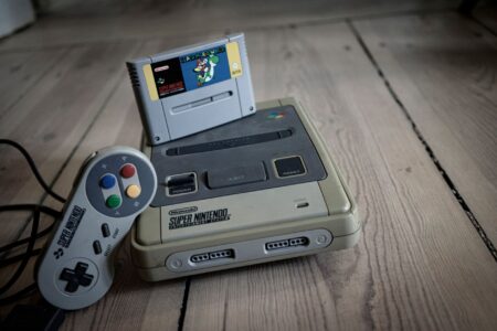 Wario’s Mainline Absence Is Quietly Fading a Fan-Favorite Villain A collection of retro video game cartridges representing classic Nintendo-era gaming history