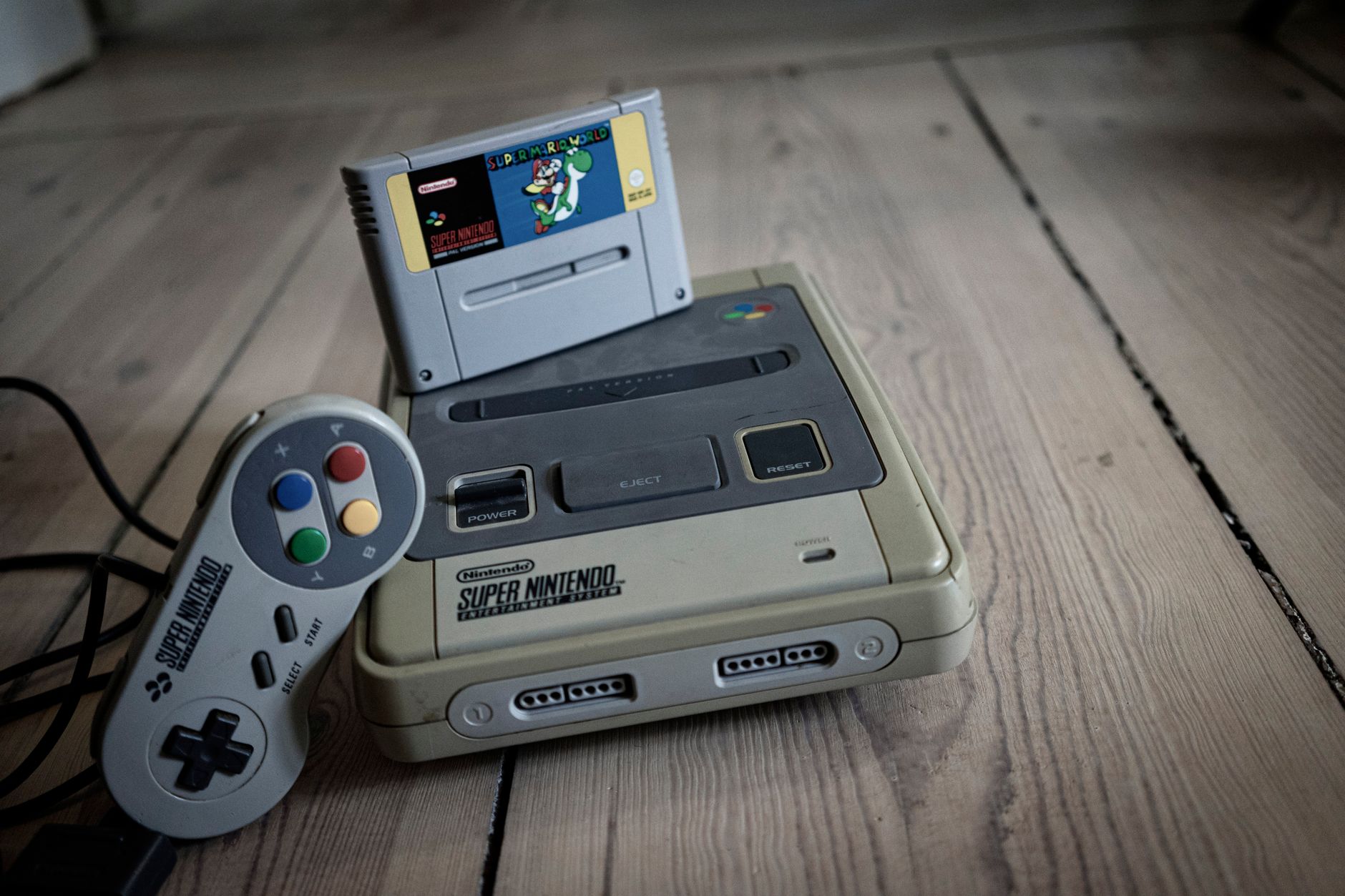 A collection of retro video game cartridges representing classic Nintendo-era gaming history