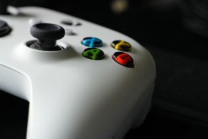 A game controller resting on a surface, representing competitive gaming