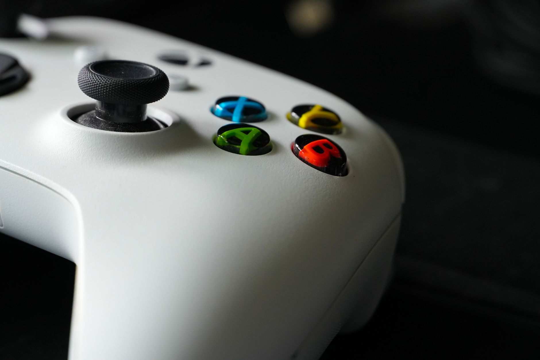 A game controller resting on a surface, representing competitive gaming