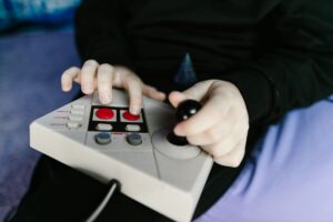 Donkey Kong Bananza’s Hard Mode Absence Is Quietly Deflating Veteran Players A vintage game controller resting on a surface, representing classic gaming challenge