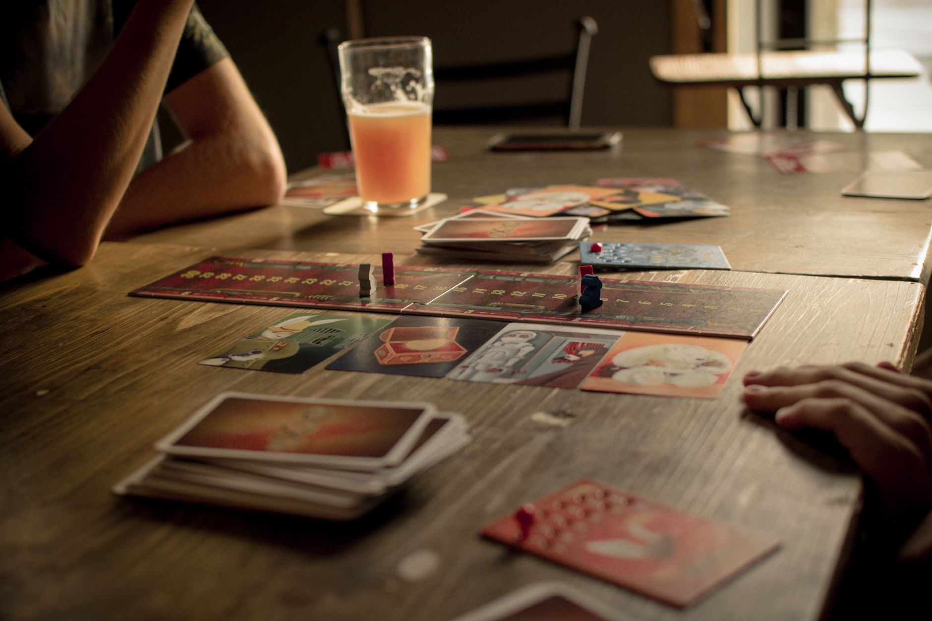 Close-up of a strategy board game with pieces arranged mid-match, representing tactical gameplay