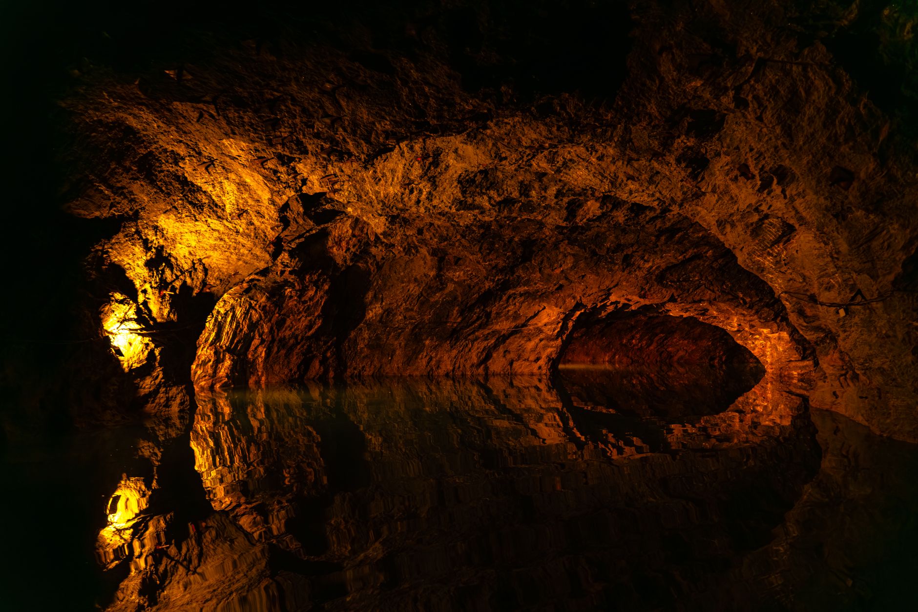 Dark underground cave tunnel suggesting the vertical depth system in Donkey Kong Bananza