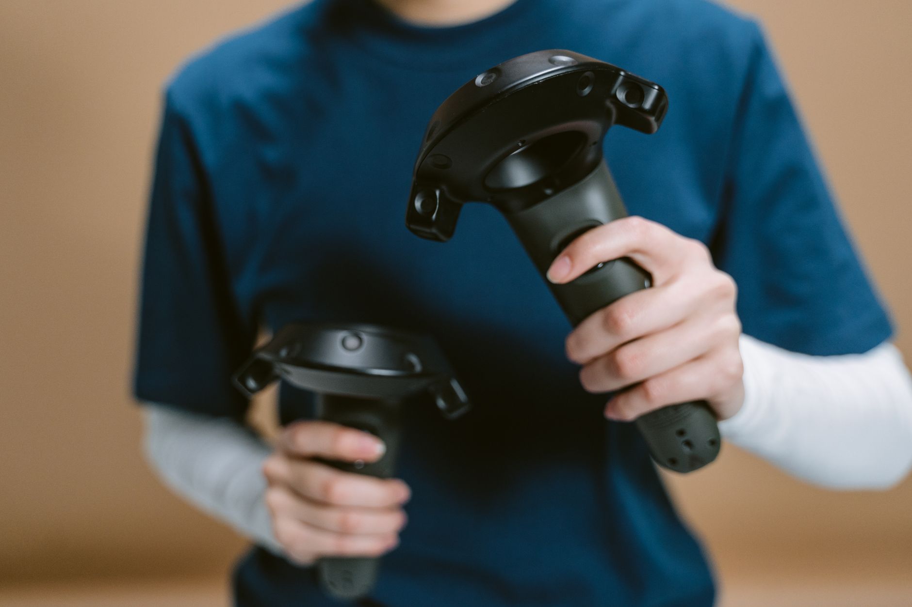 Close-up of hands holding a motion-sensitive game controller