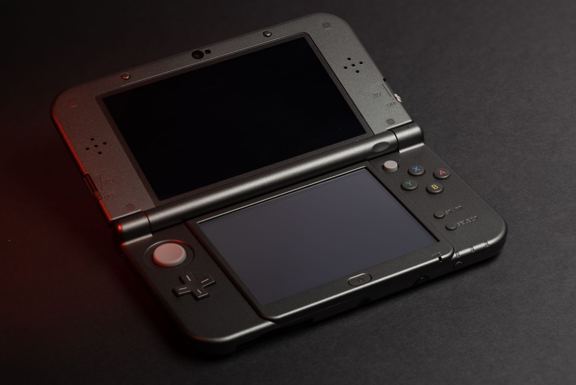 Close-up of hands holding a portable gaming console during a session