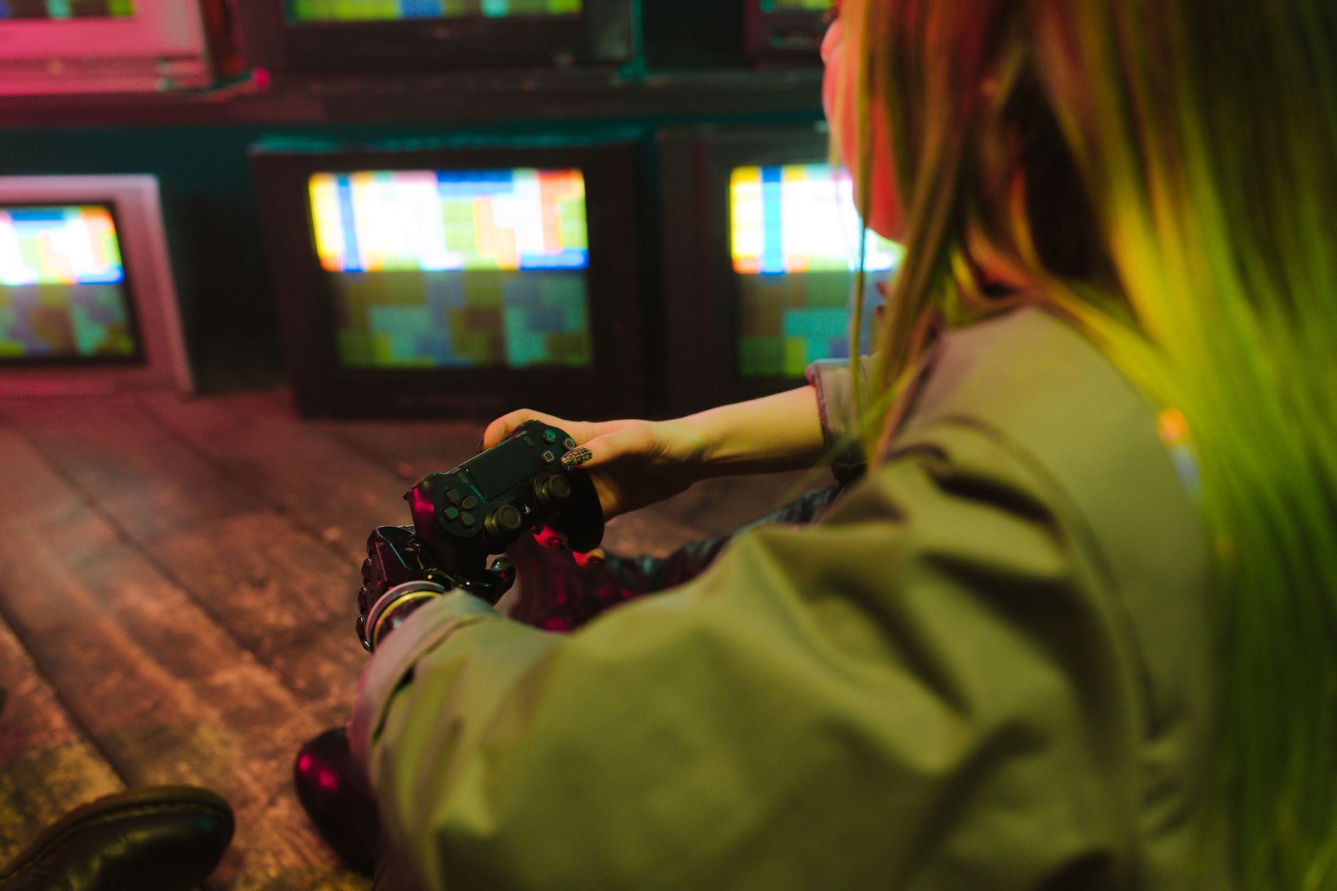Player using gaming controller with accessibility settings on screen