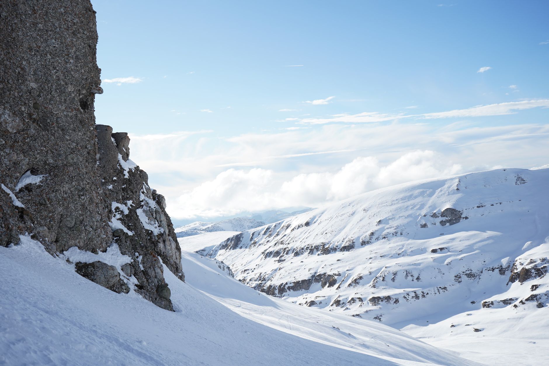 A snow-covered mountain landscape reminiscent of the frozen worlds in Donkey Kong Country Tropical Freeze