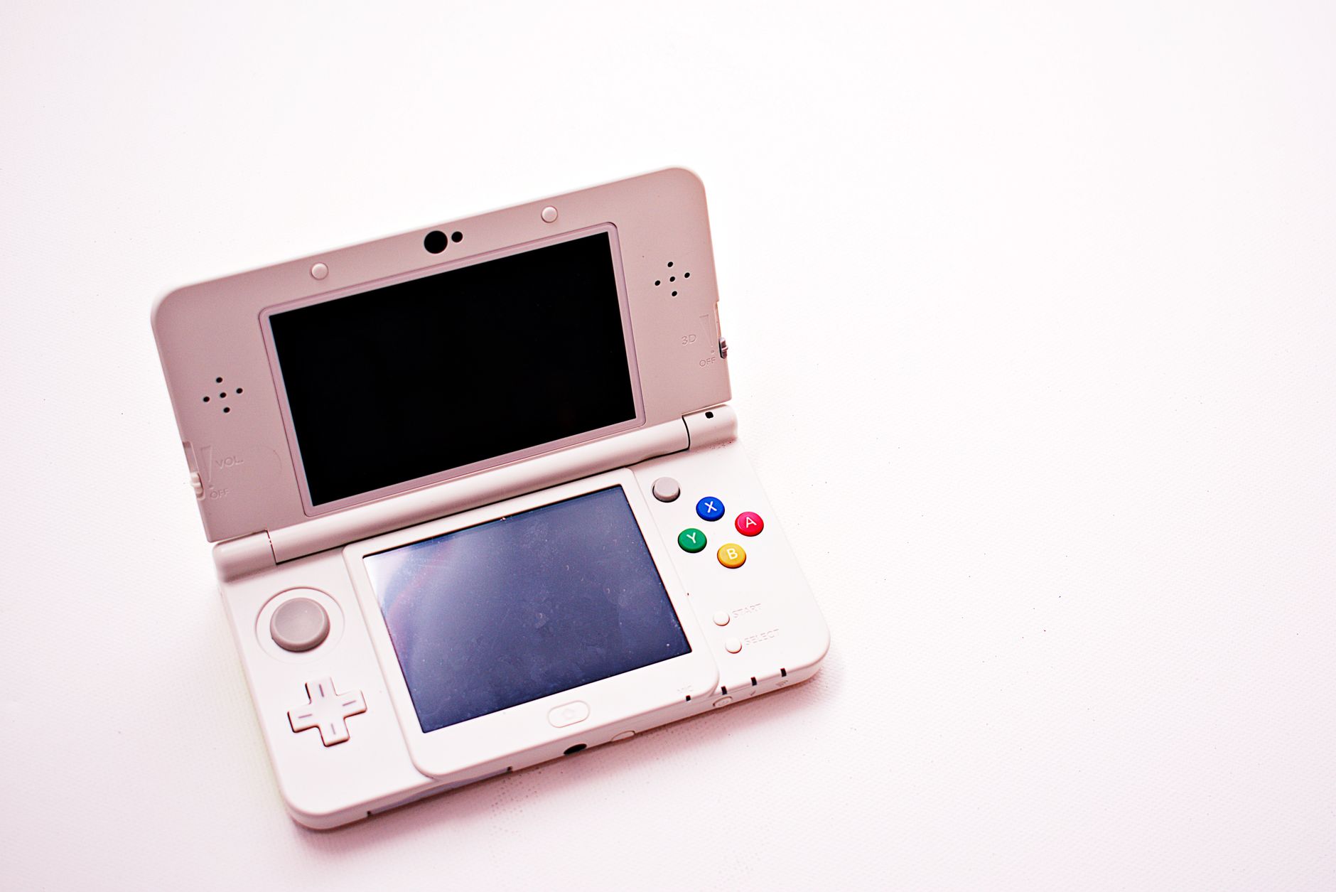 A person playing a handheld gaming console in portable mode