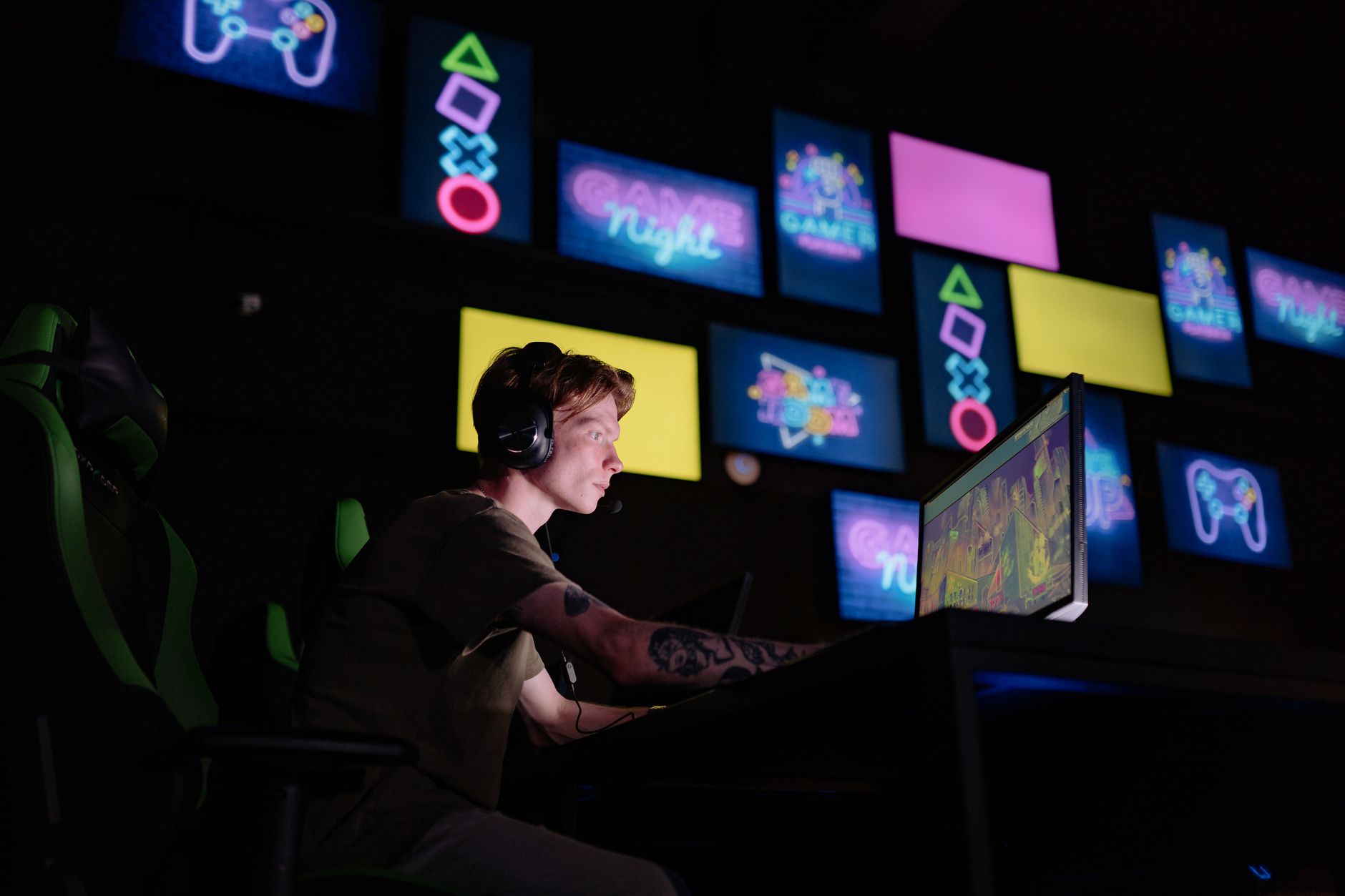 Single player gaming alone in dim room with controller in hand