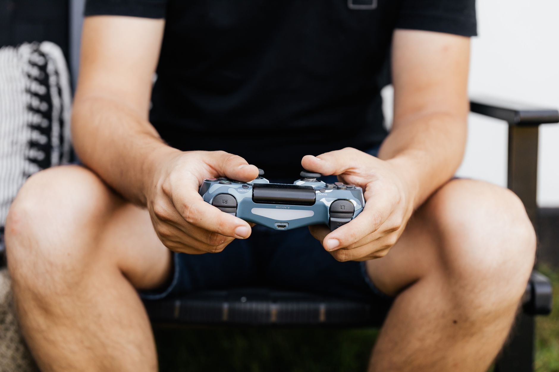 A single game controller resting on a surface, representing solo play focus