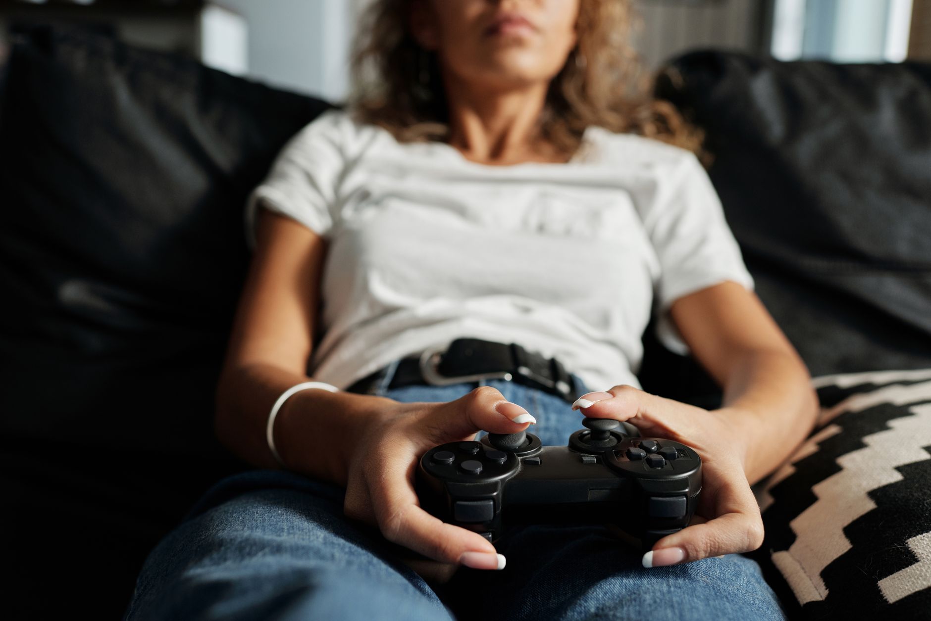 A frustrated gamer holding a controller, representing fan disappointment with a game's direction