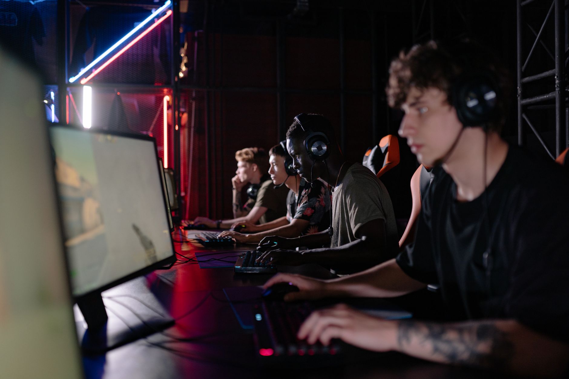 A person sitting in front of a screen with a frustrated expression, representing player disappointment