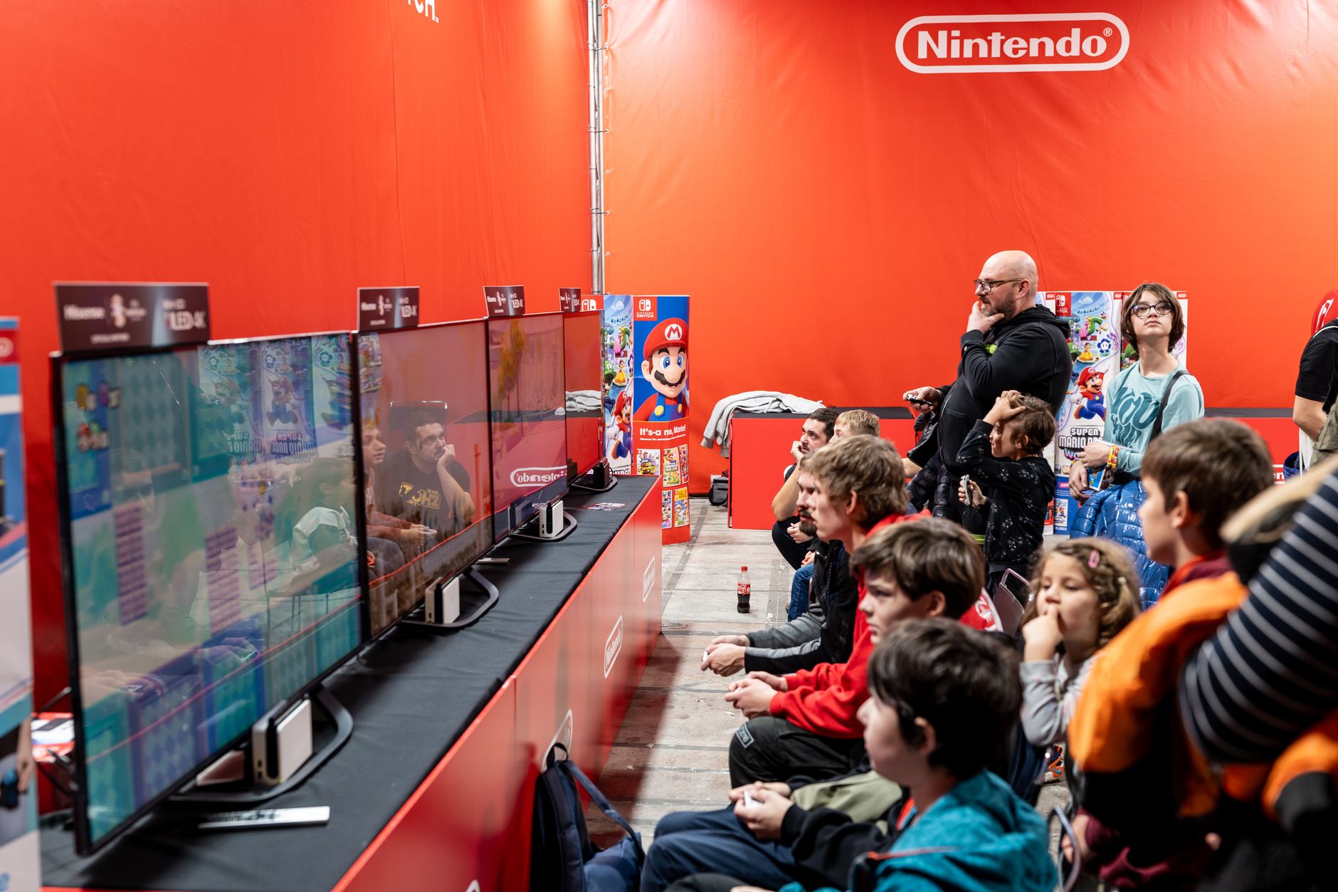 Enthusiastic gaming fans gathered at an event, representing the passionate Nintendo fan community