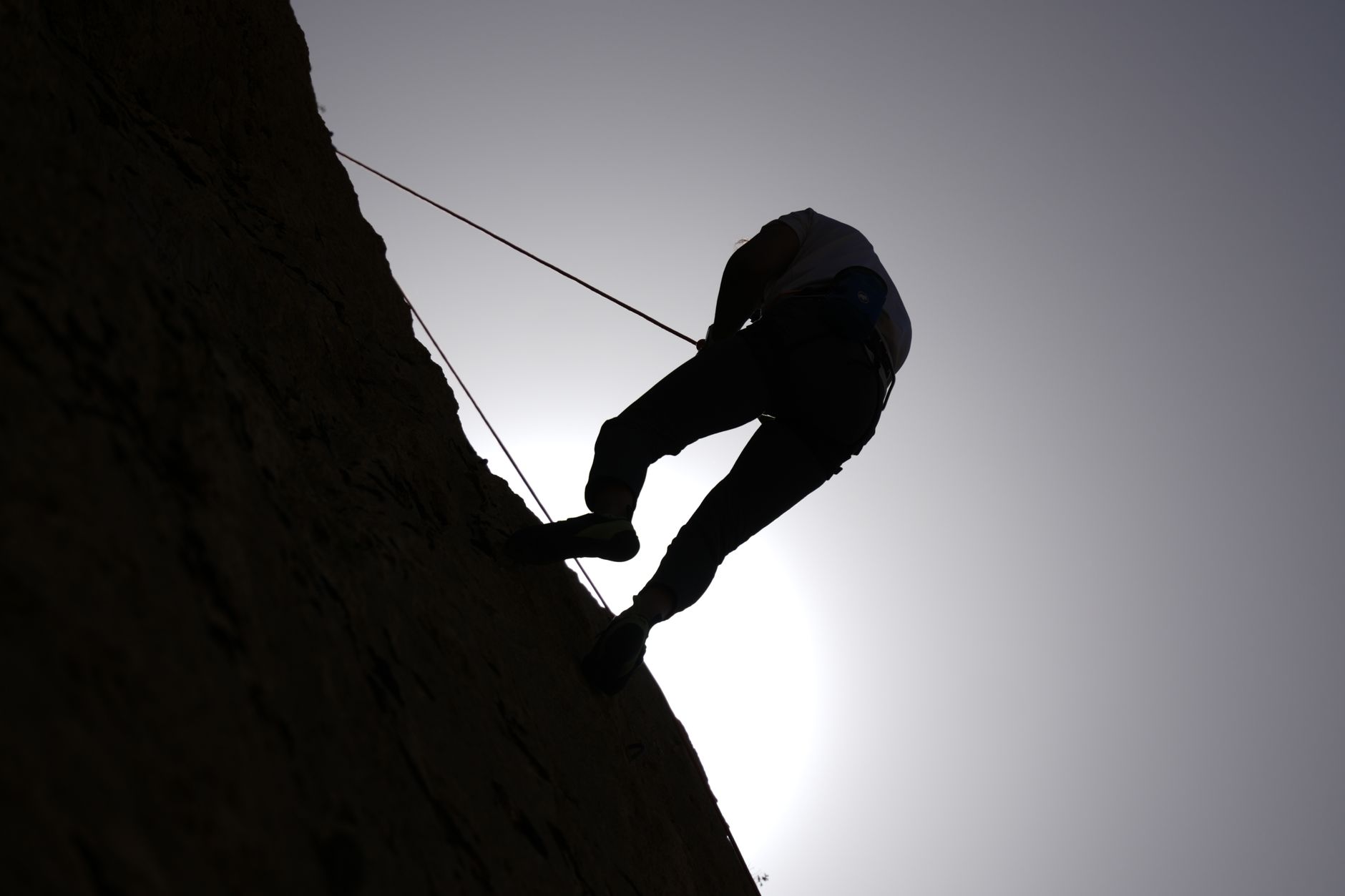 A steep vertical mountain face, illustrating the exhausting nature of constant upward and downward traversal