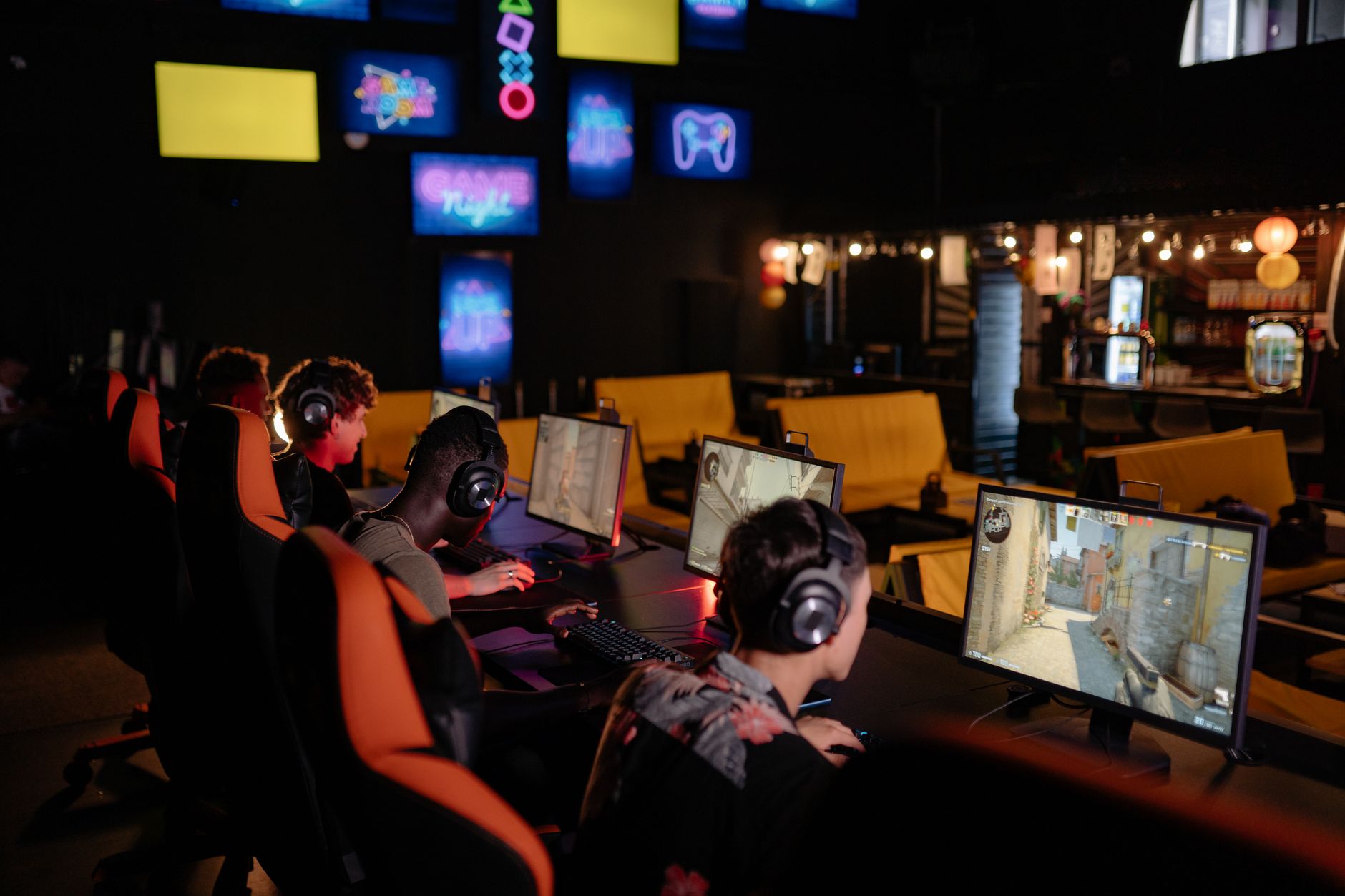People gathered around screens engaging with a gaming community online