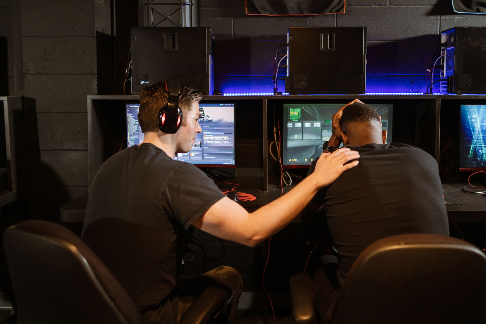 A person looking intently at a gaming screen with a focused expression