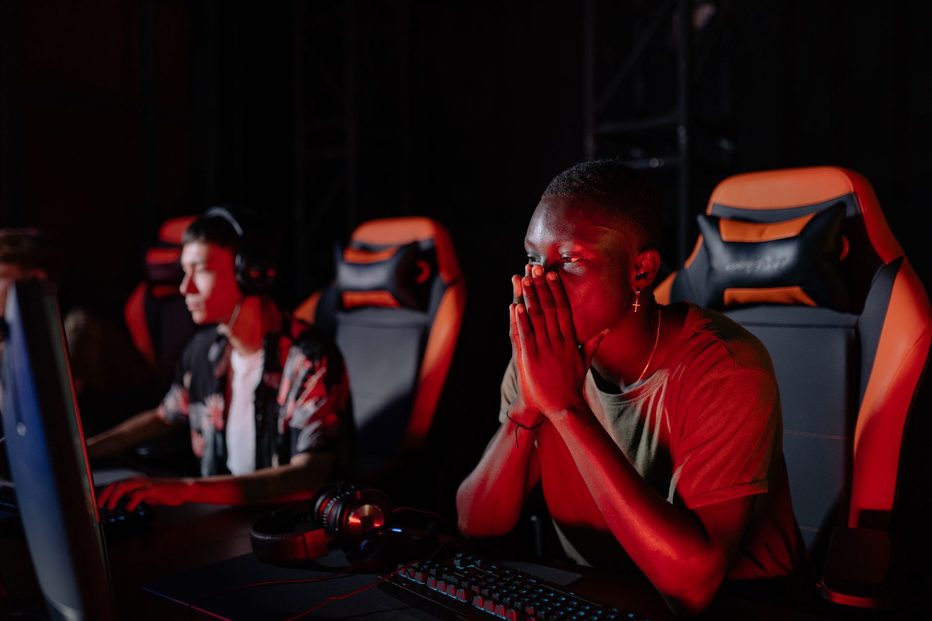 A gamer looking at a screen with a frustrated expression, reflecting fan disappointment