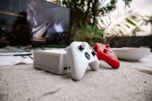 Donkey Kong Bananza’s Docked Mode Praise Is Quietly Shadowing Switch 2 Lite Hopes A gaming setup with a large television displaying a colorful video game