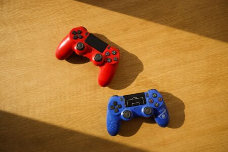 Donkey Kong Bananza’s Absent Balloon Animals Are Quietly Alienating DKCR Fans A game controller resting near tropical foliage, representing the Donkey Kong gaming aesthetic