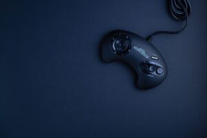 A retro gaming controller resting on a surface, evoking classic console gaming nostalgia