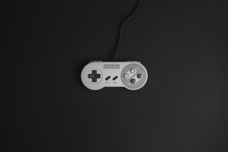 A retro video game controller resting on a flat surface, evoking classic gaming nostalgia