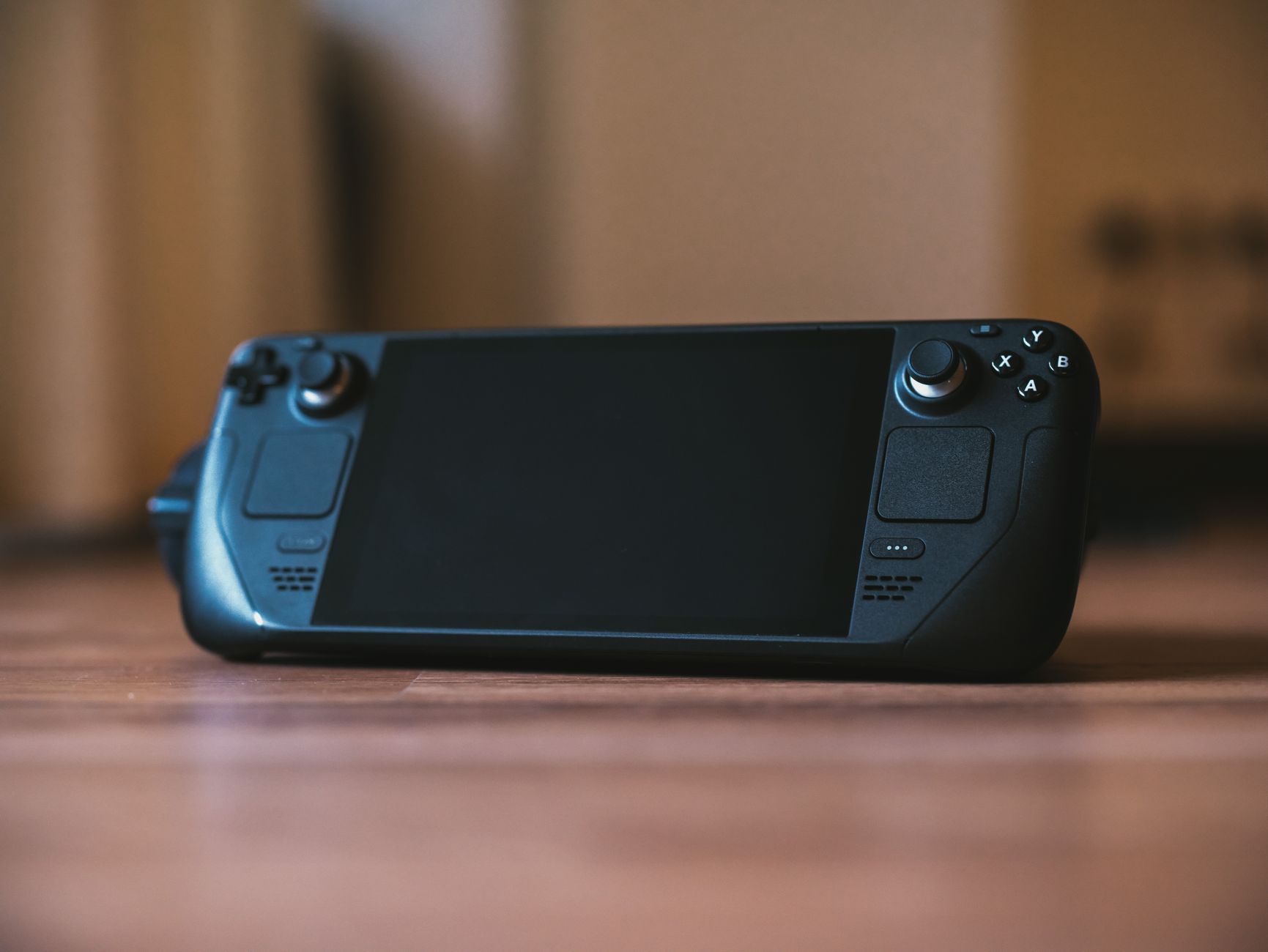 Person holding a handheld gaming console with both hands