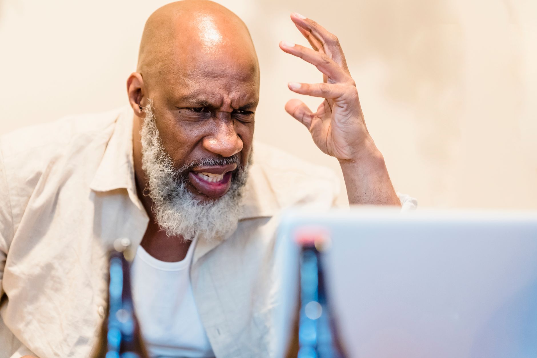 Gamer looking frustrated at a screen, representing fan disappointment with missing game mechanics