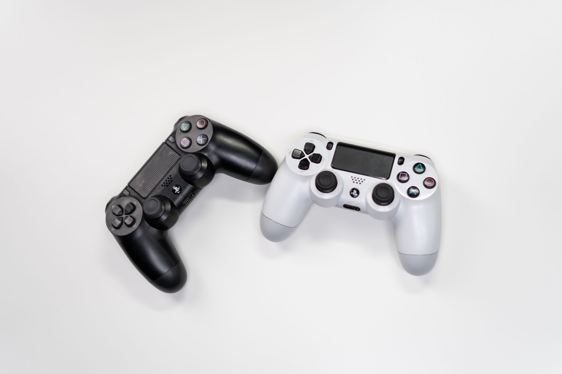 A gamer holding a controller, representing fan debate over game story decisions
