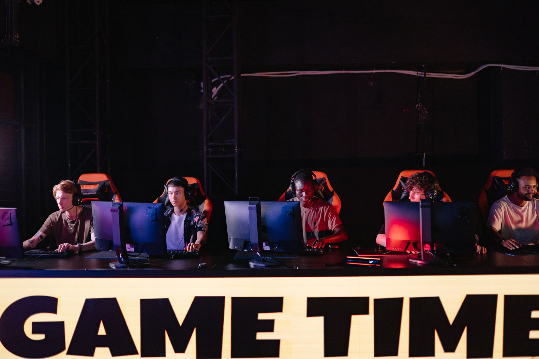 A competitive gaming setup with multiple monitors, representing leaderboard and category decisions in speedrunning communities