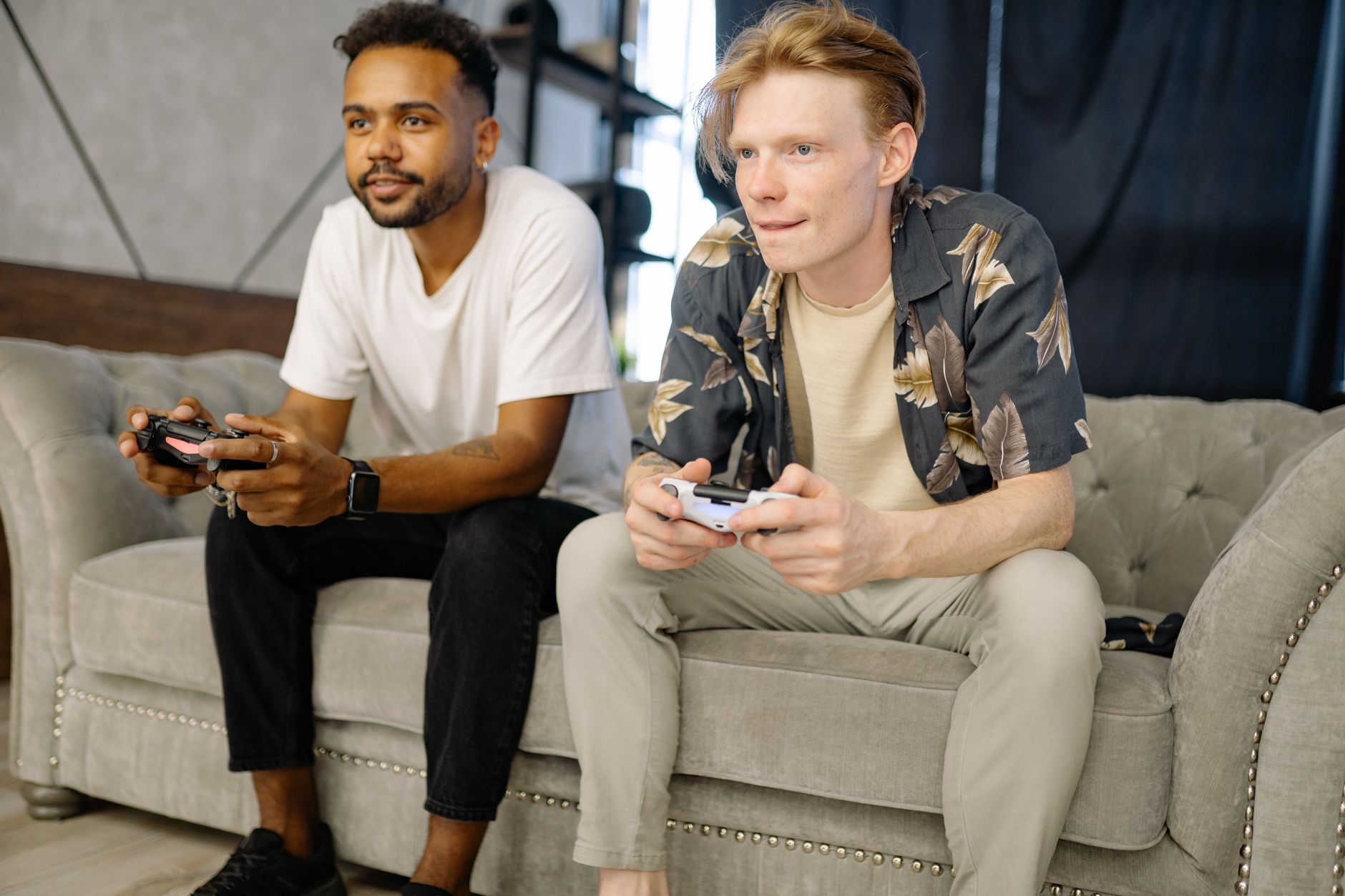 Group of friends gathered around a TV for a shared gaming session