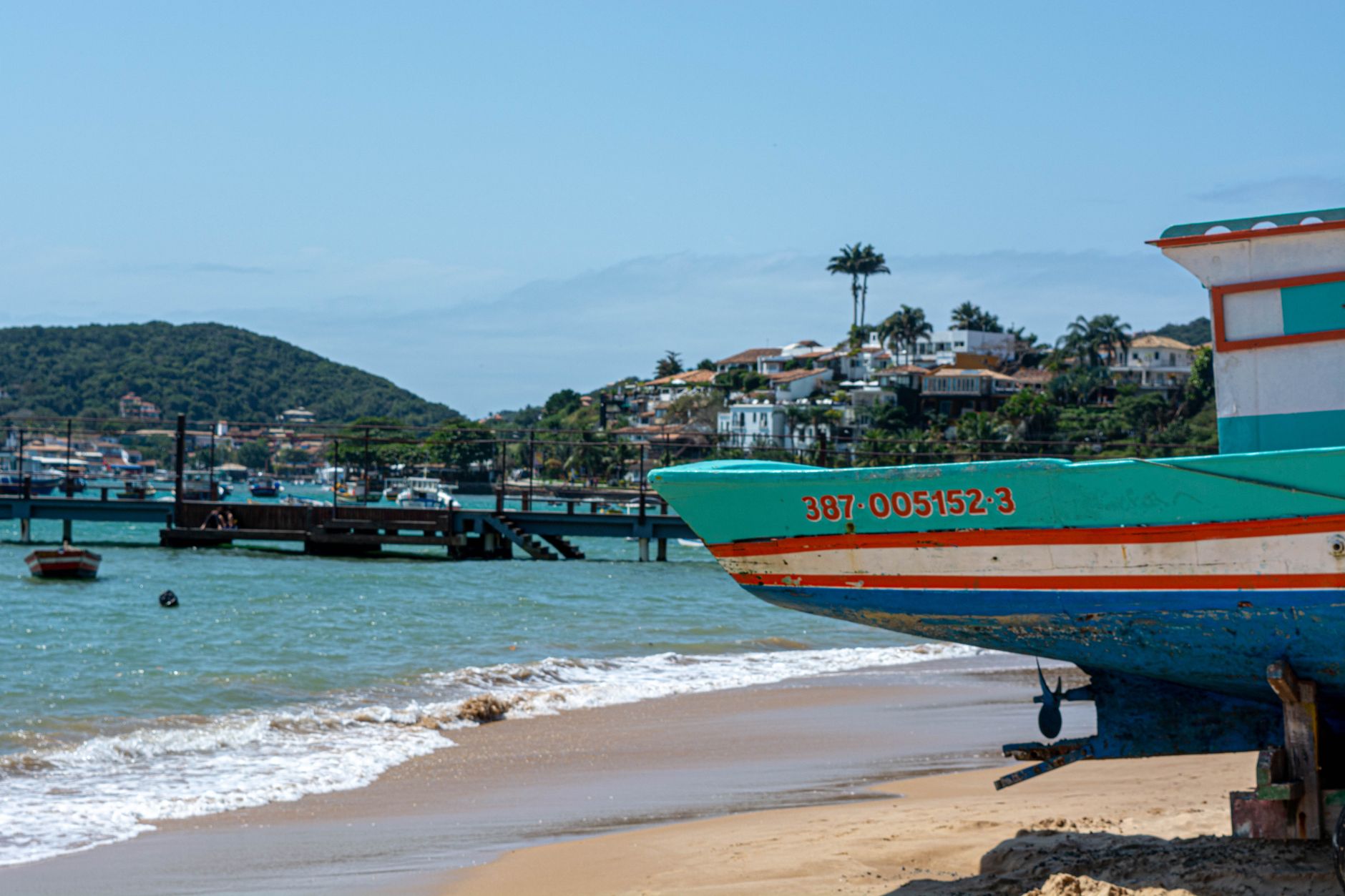 A wooden boat docked at a tropical shore, evoking the island adventure setting of classic Donkey Kong games