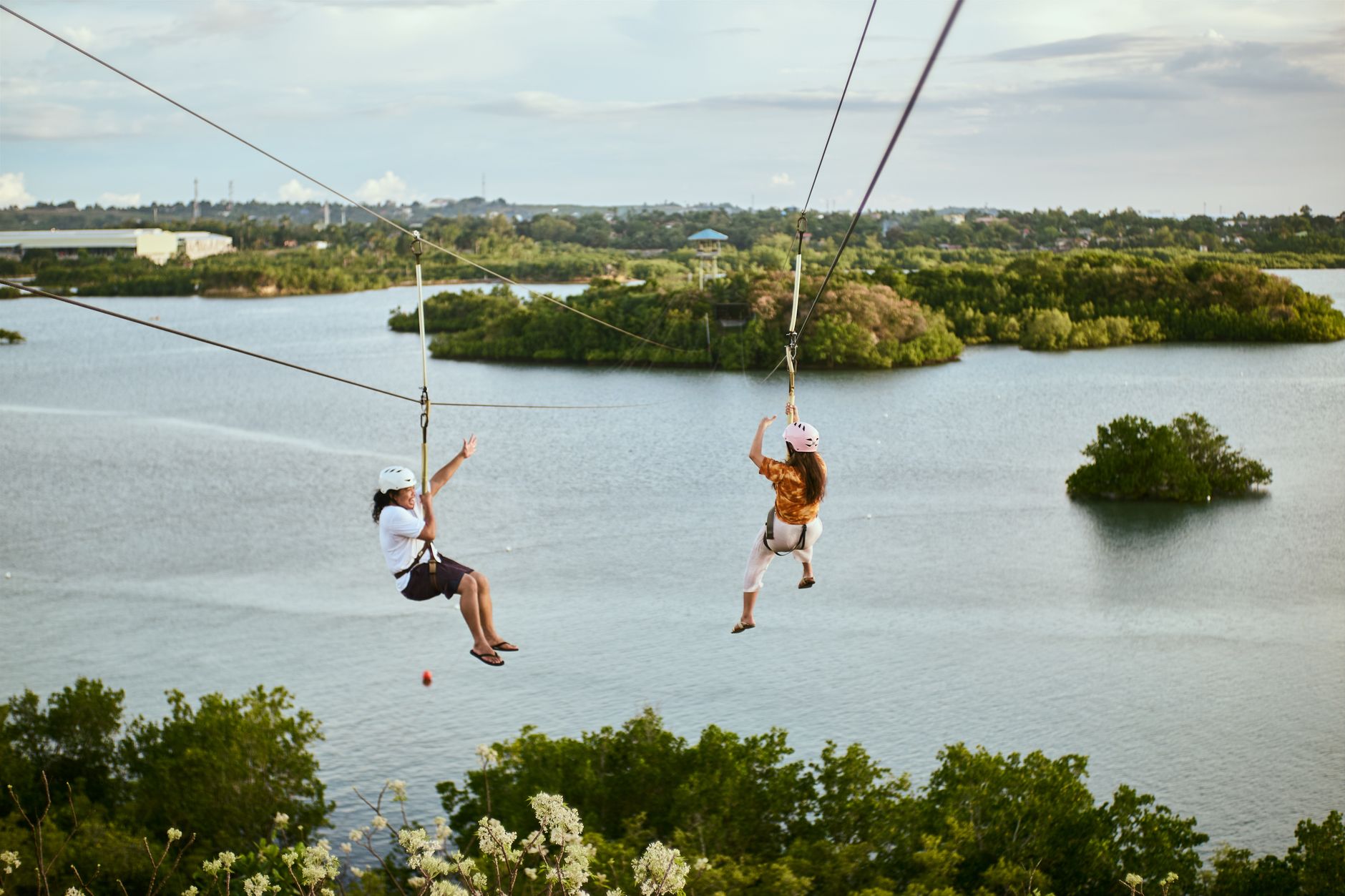 A zipline cable stretched through a dense jungle canopy, representing fast traversal mechanics in platformer games