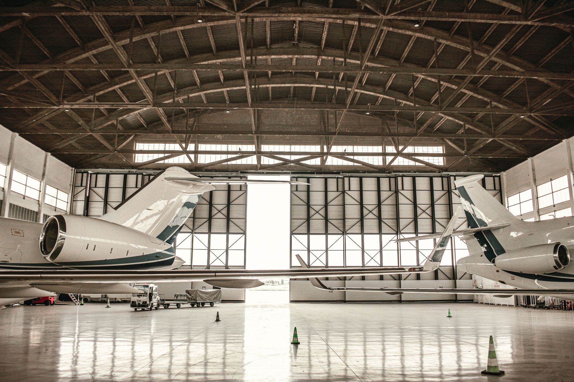 A classic airplane parked in a hangar, evoking Funky Kong's iconic flight service from the Donkey Kong Country series