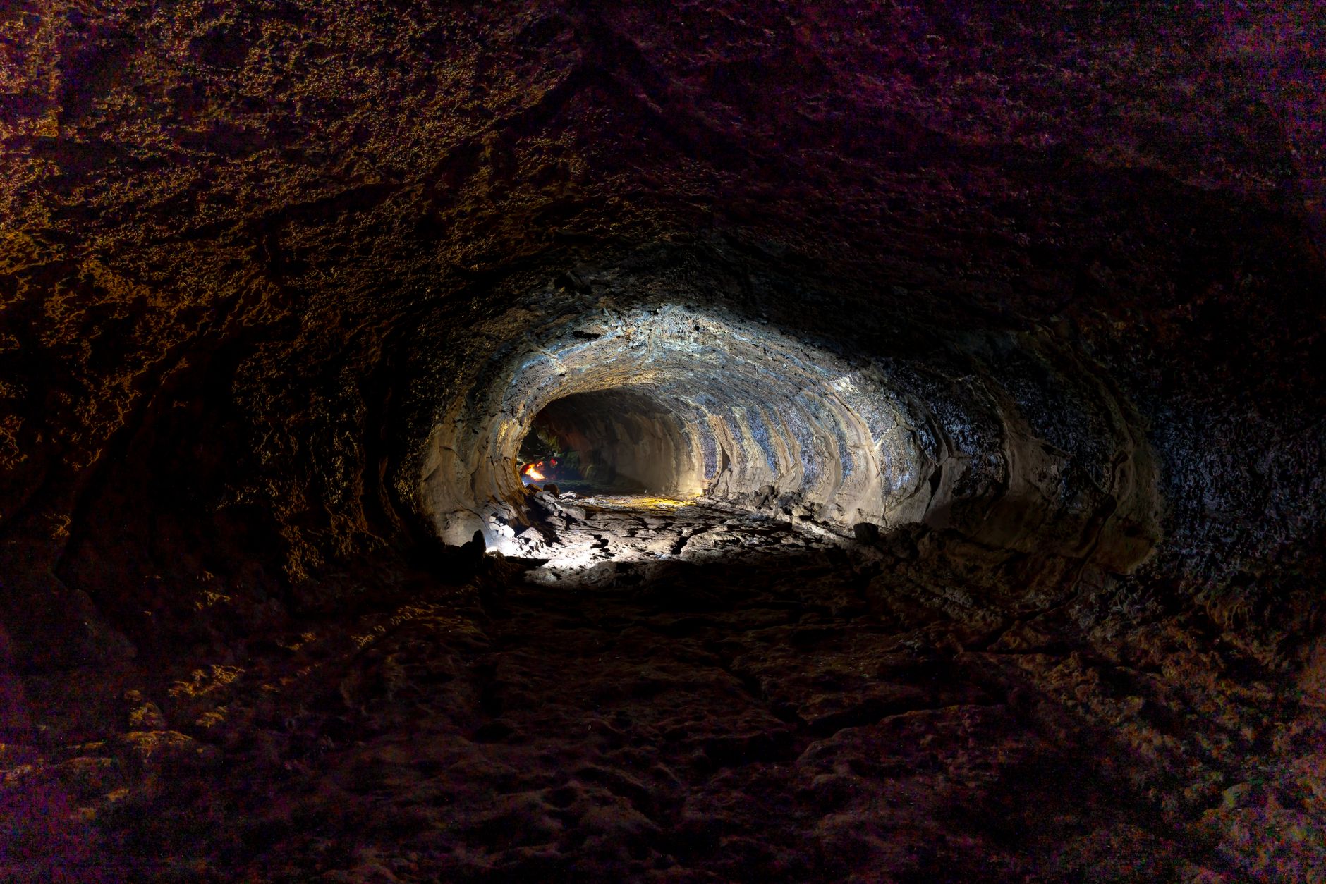 A dark underground cave tunnel suggesting the subterranean world of Donkey Kong Bananza