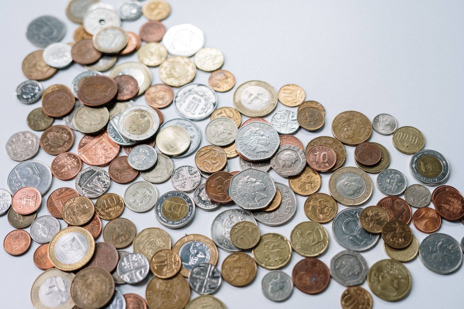 A pile of gold coins representing in-game currency and collectibles